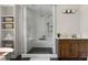 Beautiful glass enclosed shower with a rainfall shower head, hand held sprayer, and built in bench at 1155 Peachtree Battle Nw Ave, Atlanta, GA 30327
