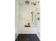 Luxurious shower with white subway tiles and a patterned tile floor at 1155 Peachtree Battle Nw Ave, Atlanta, GA 30327