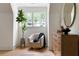 Cozy sitting area featuring hardwood floors, side table with a gold finish, artwork and a large mirror at 1155 Peachtree Battle Nw Ave, Atlanta, GA 30327