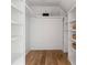 Spacious walk-in closet with custom built-in shelving at 1155 Peachtree Battle Nw Ave, Atlanta, GA 30327