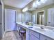 Bright bathroom with double vanity sinks, tile floor, and ample counter space provides a functional and stylish space at 174 Vintage Club Cir, Marietta, GA 30066