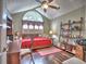 Cozy bedroom featuring a vaulted ceiling, a ceiling fan, and a large window that offers plenty of natural light at 174 Vintage Club Cir, Marietta, GA 30066
