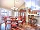 Elegant dining area adjacent to the kitchen, featuring hardwood floors and a modern chandelier at 174 Vintage Club Cir, Marietta, GA 30066