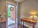 Warm foyer featuring hardwood floors, console table, and a view of the front yard at 174 Vintage Club Cir, Marietta, GA 30066