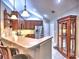 Well-equipped kitchen with stainless steel appliances and breakfast bar seating at 174 Vintage Club Cir, Marietta, GA 30066