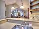 Open-concept kitchen showcasing countertops and view to the breakfast and living room at 174 Vintage Club Cir, Marietta, GA 30066