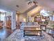Comfortable living room boasts hardwood floors, a stylish rug, and an open layout with access to other areas of the house at 174 Vintage Club Cir, Marietta, GA 30066