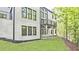 Well-maintained backyard featuring a covered patio and a view of the natural surroundings at 2346 East Maddox Rd, Buford, GA 30518