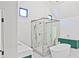 Modern bathroom features marble floors, glass shower, and soaking tub at 2346 East Maddox Rd, Buford, GA 30518