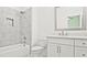 Bathroom with marble-tiled shower and white vanity with quartz countertop at 2346 East Maddox Rd, Buford, GA 30518