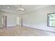 Bright bedroom featuring recessed lighting, tray ceiling, and light hardwood flooring at 2346 East Maddox Rd, Buford, GA 30518
