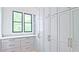 Walk-in closet with built-in storage units, drawers, and window with natural light at 2346 East Maddox Rd, Buford, GA 30518