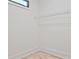 Walk-in closet featuring hardwood floors and wire shelving at 2346 East Maddox Rd, Buford, GA 30518