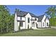 Elegant two-story home with dark accents and lush green lawn at 2346 East Maddox Rd, Buford, GA 30518