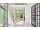 Bright foyer with hardwood floors, staircase, and open floor plan at 2346 East Maddox Rd, Buford, GA 30518