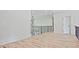 The hallway on the second story features sleek hardwood floors and white walls, creating a modern, stylish look at 2346 East Maddox Rd, Buford, GA 30518