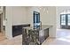 Modern kitchen with a marble waterfall island, custom cabinetry and stainless steel appliances at 2346 East Maddox Rd, Buford, GA 30518
