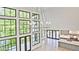 Aerial view of living room features large windows, modern lighting, and open concept kitchen at 2346 East Maddox Rd, Buford, GA 30518