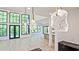 Open-concept living area with high ceilings, large windows, and modern lighting fixtures at 2346 East Maddox Rd, Buford, GA 30518
