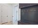 Mud room features a built-in bench with coat hooks and access to the garage at 2346 East Maddox Rd, Buford, GA 30518