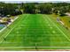 Aerial view of a well-maintained football field, offering an excellent venue for sports and recreational activities at 7455 Cordery Rd, Cumming, GA 30040