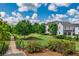 Backyard with trees, green spaces, and manicured walkways, offering a peaceful retreat at 7455 Cordery Rd, Cumming, GA 30040