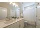 Bathroom with double sinks, white cabinets, and a shower with white curtain at 7455 Cordery Rd, Cumming, GA 30040