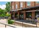 Exterior of Cherry Street Brewing featuring outdoor seating, awning, and brick facade at 7455 Cordery Rd, Cumming, GA 30040