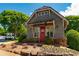 Adorable nail salon with inviting curb appeal, showcasing a well-maintained landscape and a charming red door at 7455 Cordery Rd, Cumming, GA 30040