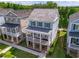 Beautiful two-story home with a welcoming front porch and manicured landscaping in a serene neighborhood at 7455 Cordery Rd, Cumming, GA 30040