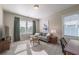 Comfortable living room with a sofa, TV, and lots of natural light at 7455 Cordery Rd, Cumming, GA 30040