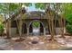 Pool house surrounded by lush trees and a stone pathway leading to the community swimming pool at 7455 Cordery Rd, Cumming, GA 30040