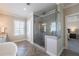 Bathroom featuring large glass enclosed shower, dual sink vanity, and separate tub at 7455 Cordery Rd, Cumming, GA 30040