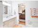 White bathroom vanity and bath with tile flooring, bedroom located next door at 1605 Barrier Rd, Marietta, GA 30066