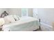 Cozy bedroom featuring a comfortable bed with decorative pillows and a window at 1605 Barrier Rd, Marietta, GA 30066