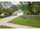 A charming single-story home with a two-car garage, set on a well-manicured lawn with mature trees and landscaping at 1605 Barrier Rd, Marietta, GA 30066