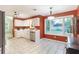 Bright kitchen features tiled floors, stainless steel appliances, white cabinetry and a large window at 1605 Barrier Rd, Marietta, GA 30066
