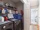 Laundry area with appliances, shelving, and storage space at 1605 Barrier Rd, Marietta, GA 30066