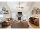 Spacious living room with vaulted ceilings, fireplace, and large windows, creating a bright and airy atmosphere at 1605 Barrier Rd, Marietta, GA 30066