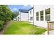 Grassy backyard featuring the side of the home, new construction at 298 Tillman Pass, Woodstock, GA 30188