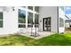 A lush backyard with a pull-up bar and patio adjacent to the house at 298 Tillman Pass, Woodstock, GA 30188