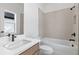 Bathroom featuring a modern sink, faucet, and white tiled shower and bathtub at 298 Tillman Pass, Woodstock, GA 30188