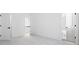Bedroom with carpeted floor, base molding, and two doorways at 298 Tillman Pass, Woodstock, GA 30188