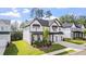 An attractive home with a two-car garage, neatly manicured lawn, and tasteful landscaping at 298 Tillman Pass, Woodstock, GA 30188