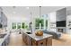 Well-designed kitchen flowing into the living room, complete with a central island and modern finishes at 298 Tillman Pass, Woodstock, GA 30188