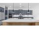 Modern kitchen with a large island, stainless steel appliances, and plenty of counter space for cooking at 298 Tillman Pass, Woodstock, GA 30188
