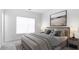Inviting main bedroom featuring stylish décor, a comfortable bed, and abundant natural light at 298 Tillman Pass, Woodstock, GA 30188