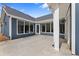 Large concrete patio with windows and blue siding with a covered porch for entertaining at 313 Sassafras Way, Holly Springs, GA 30115