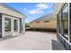 Wide concrete patio featuring new construction and exterior blue siding at 313 Sassafras Way, Holly Springs, GA 30115