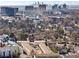 Aerial view of a residential area with a city skyline in the distance at 3408 Landen Pine Ne Ct, Atlanta, GA 30305